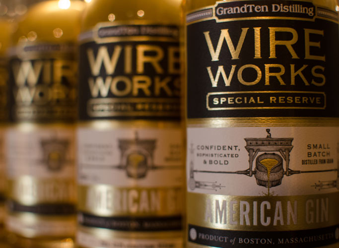 Small batch Wire Works Special Reserve Bourbon whiskey barrel aged craft gin at GrandTen Distillery cocktail bar and Boston speakeasy tasting counter