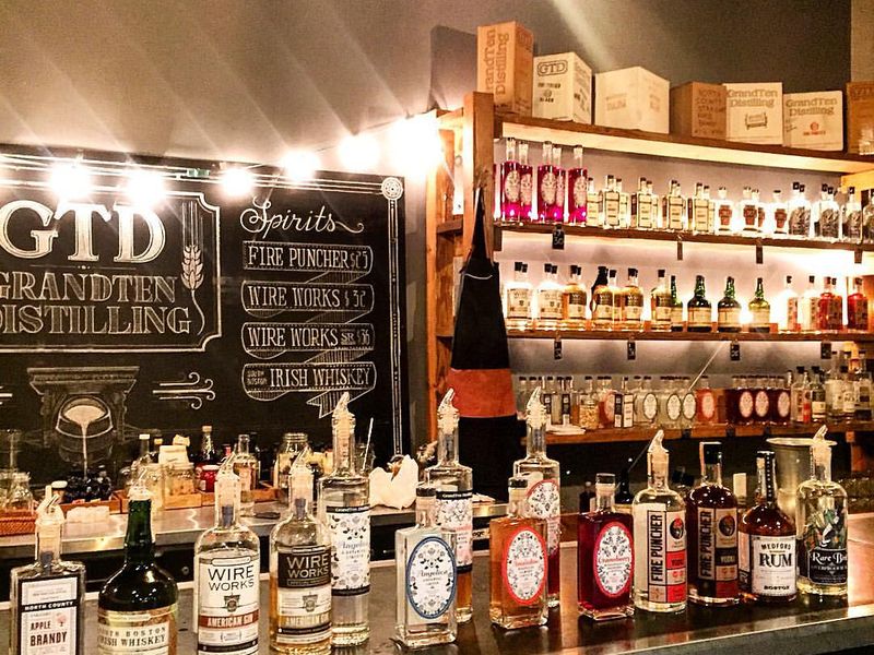 New England craft small batch spirits available at GrandTen Distillery Boston tasting counter and speakeasy cocktail bar